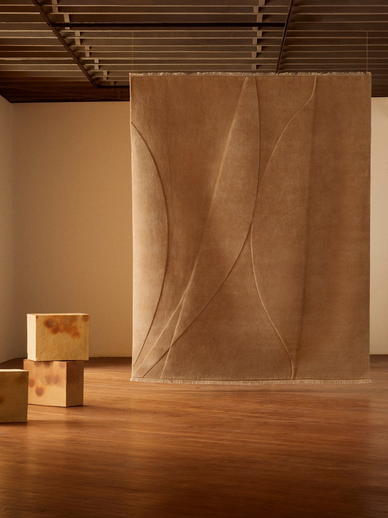 Armadillo Marea Rug in Clay, hand-knotted and hand-carved wool rug shown in a room setting