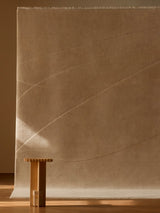 Armadillo Marea Rug in Vellum, hand-knotted and hand-carved wool rug shown in a room setting