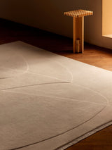 Armadillo Marea Rug in Savon, hand-knotted and hand-carved wool rug shown in a room setting