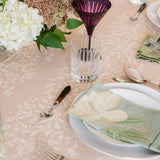 Maison Venu Marguerite tablecloth in primrose sand with a white botanical vine print, styled with floral place settings