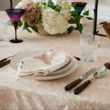 Maison Venu Marguerite Primrose Sand tablecloth with hand block-printed botanical vine motif on a dining table