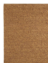 Armadillo Mason Rug in Yolk, corner close-up of the new zealand wool pile and edge