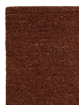 Armadillo Mason Rug in Sangria, corner close-up of the new zealand wool pile and edge