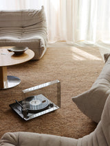 Armadillo Meadow Rug in Tamarillo, hand-knotted wool rug shown in a room setting