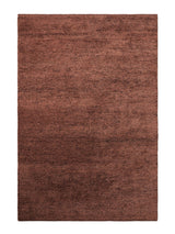 Armadillo Meadow Rug in Brick, overhead view of the hand-knotted wool weave and edge finish