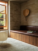 Armadillo Meadow Rug in Pistachio, hand-knotted wool rug shown in a room setting