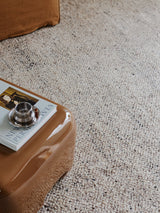 Armadillo Meadow Rug in Driftwood, a second view of the hand-knotted wool rug in a styled interior