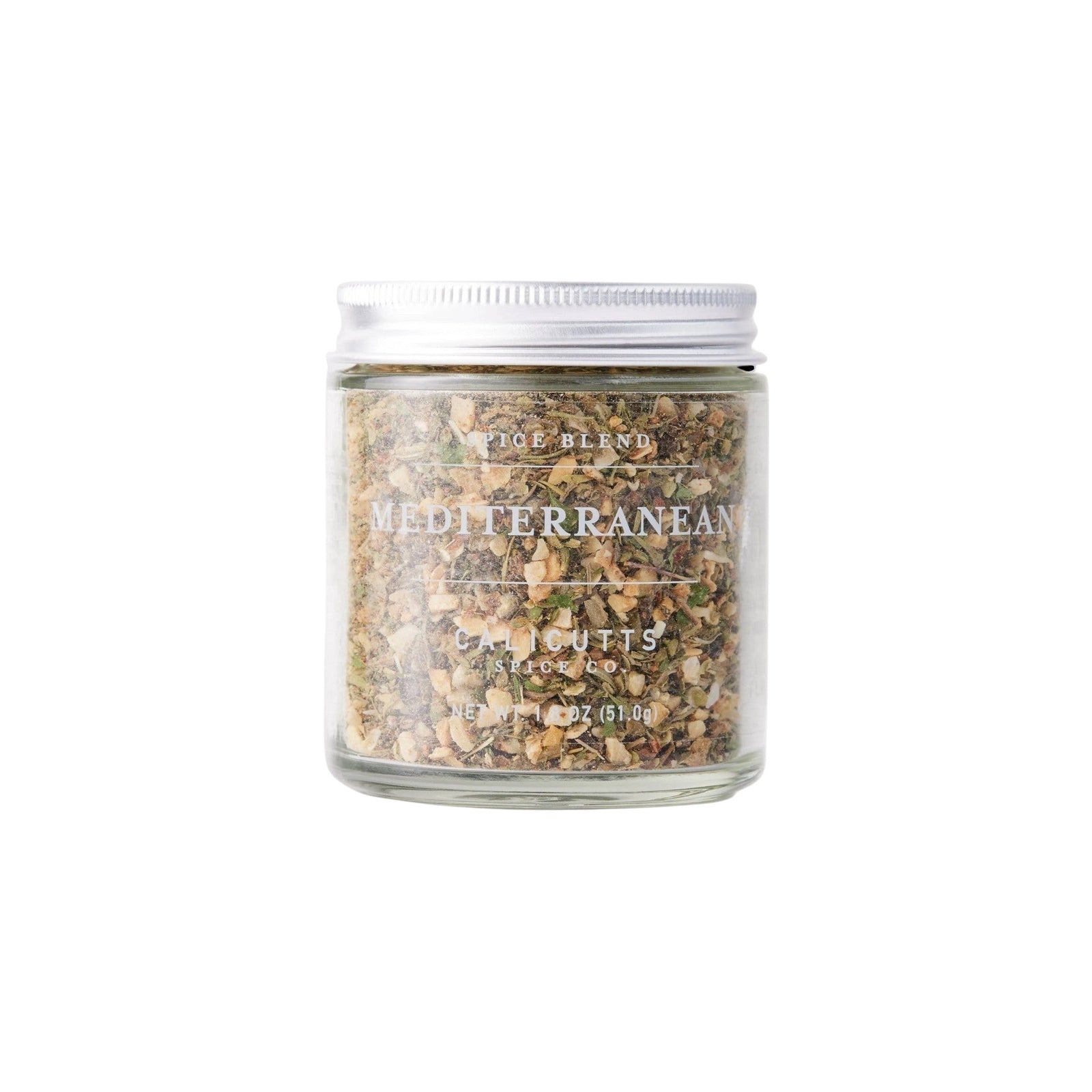 Calicutts Mediterranean spice blend in a clear glass jar with a silver lid, featuring dried herbs and garlic.