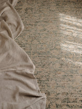 Armadillo Minuet Rug in Skylark, a second view of the hand-knotted clipped wool rug in a styled interior
