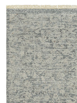 Armadillo Minuet Rug in Skylark, corner close-up of the wool pile and edge