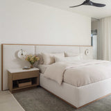 Mira Long Lumbar Pillow detail — elongated silhouette with corner tassels, styled on a bed or bench