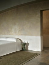 Armadillo Mojave Rug in Laurel, a second view of the hand-knotted jute rug in a styled interior