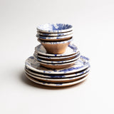 Hand-thrown Italian terra cotta mixing bowl in blue splatter glaze