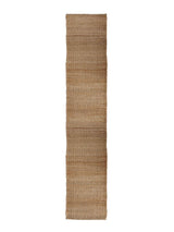 Armadillo Nest Nook Rug in Natural, overhead view of the handwoven jute flatweave weave and edge finish