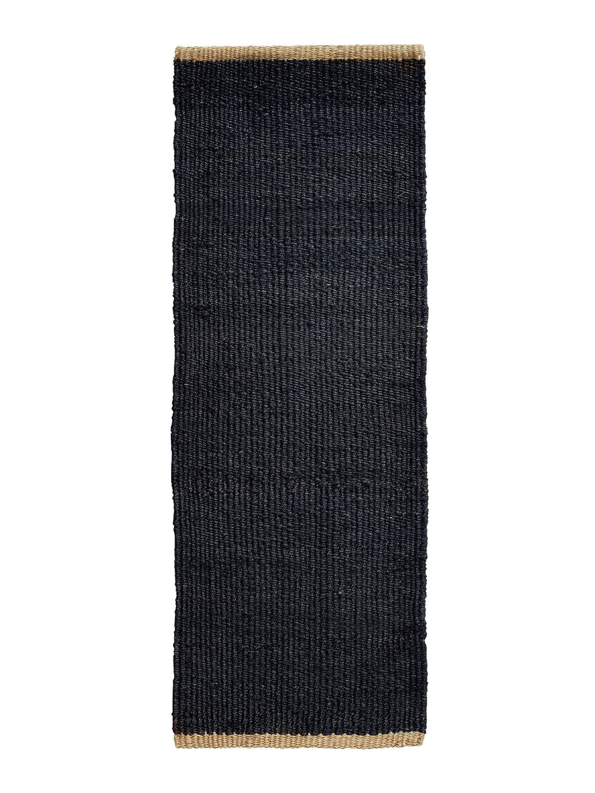 Armadillo Nest Nook Rug in Charcoal, a second view of the handwoven jute flatweave rug in a styled interior