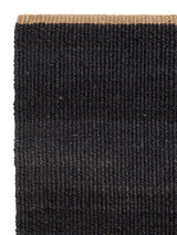 Armadillo Nest Nook Rug in Charcoal, corner close-up of the jute pile and edge
