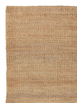 Armadillo Nest Nook Rug in Natural, corner close-up of the jute pile and edge
