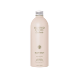 A cream aluminum Flamingo Estate Euphoria Body Wash bottle with silver cap and floral botanicals label sits on a white background, ready for the shower.