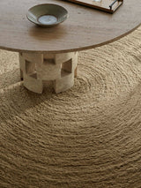 Armadillo Nimbus Rug in Wasabi, hand-braided new zealand wool rug shown in a room setting