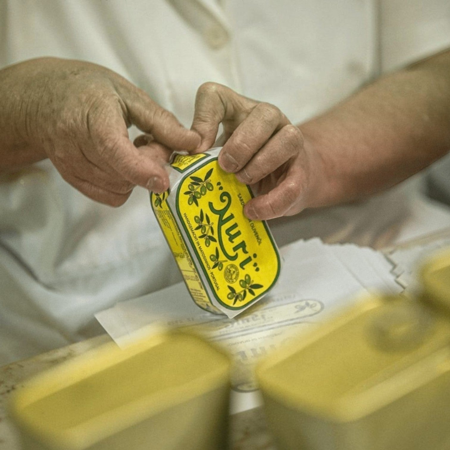 Open Nuri Sardines tin showing olive oil and sardines