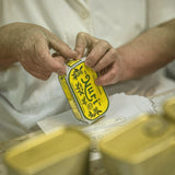 Open Nuri Sardines tin showing olive oil and sardines
