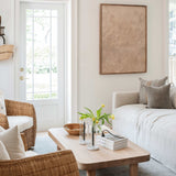 Naia Graphite Pillow — detail view showing hand-tied tassel corner and natural linen weave texture