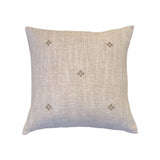 Isak Taupe Pillow by One Bi One — hand-embroidered Belgian linen in caramel taupe, available in 18×15" and 16×16", handcrafted in Gothenburg, Sweden
