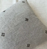 Close-up of the Isak Gray Pillow cross embroidery detail in wool on Belgian linen