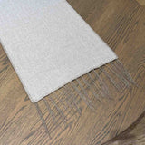 Elise Taupe Table Runner detail — close-up of delicate wool embroidery on soft Belgian linen