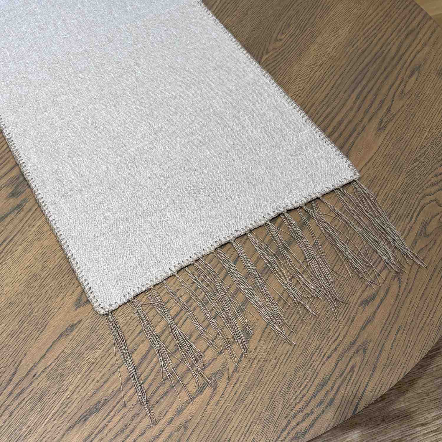 Elise Taupe Table Runner detail — close-up of delicate wool embroidery on soft Belgian linen