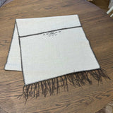 Noa Cream & Chocolate Table Runner by One Bi One — Belgian linen with chocolate wool embroidery and tassels, handcrafted in Gothenburg, Sweden