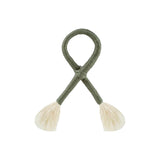 Calimia Home olive green nautical knot napkin ring with cream-colored tassel ends for coastal table decor.