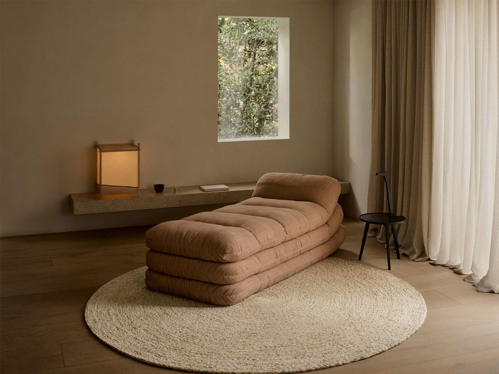 Armadillo Onsen Rug in Papyrus, hand-braided wool and jute rug shown in a room setting