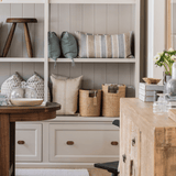 Oval abaca basket, styled with throws in living room setting