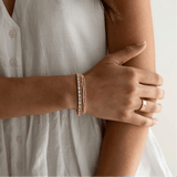 Oval tennis bracelet styled on wrist