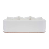 Calimia Home Owens sofa in white Belgian linen with a curved back and natural oak plinth base, rear view.