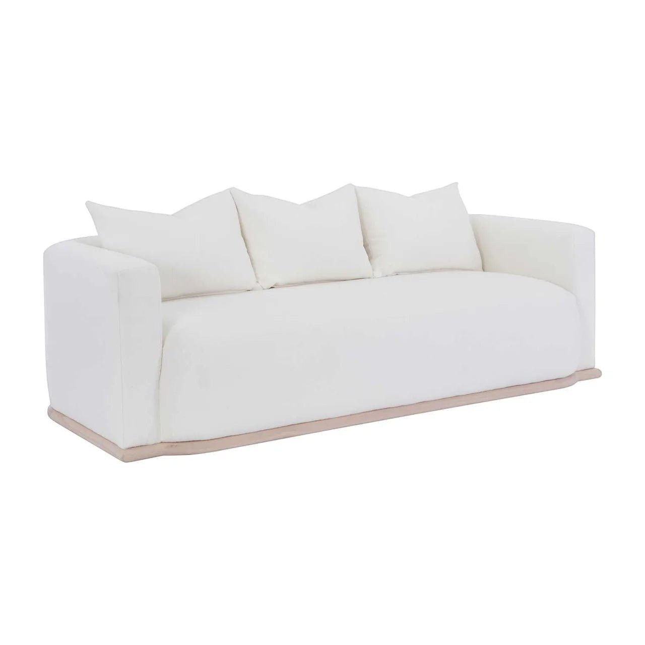Calimia Home Owens sofa in white Belgian linen with a curved back and natural oak plinth base on a white background.