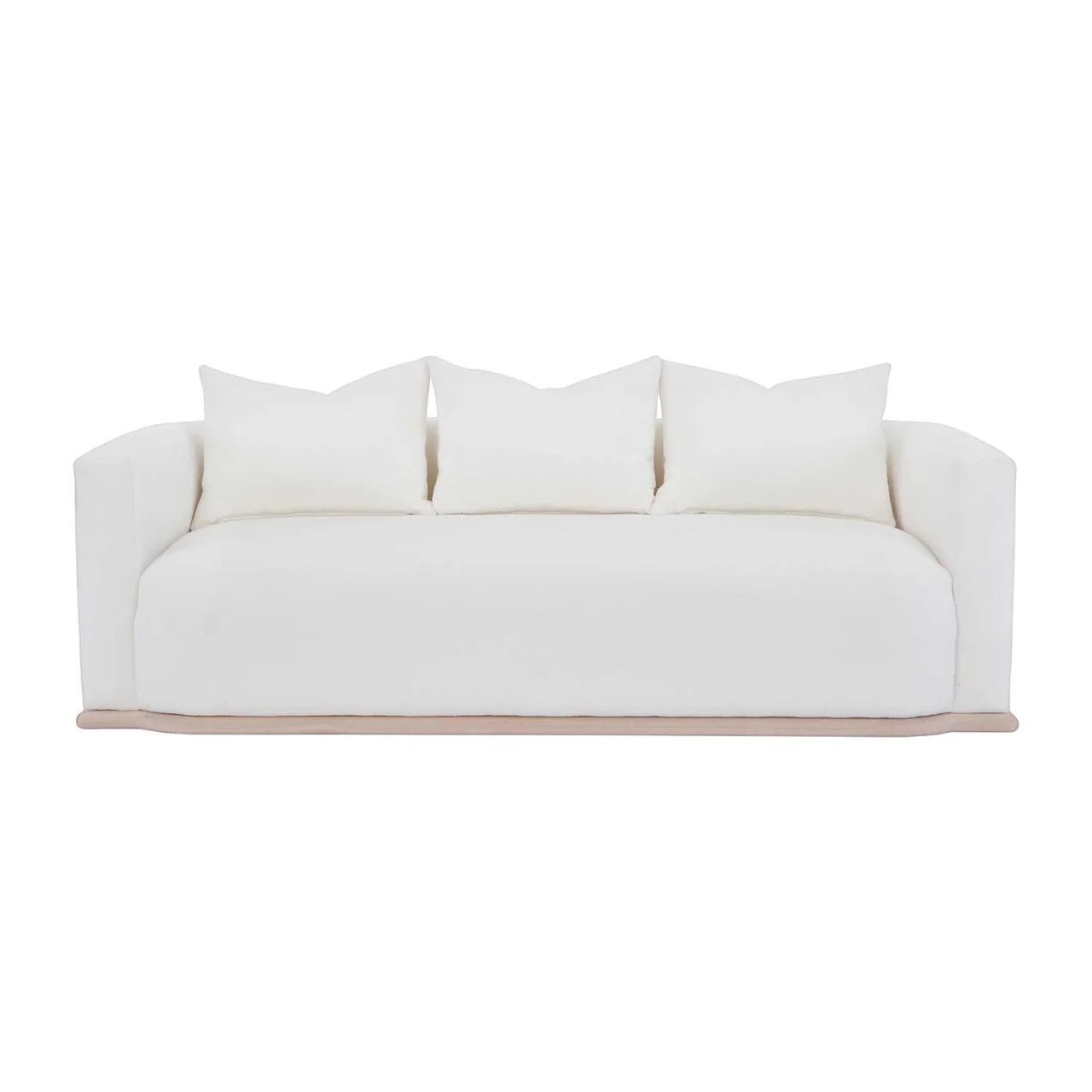 Calimia Home Owens Sofa in white Belgian linen with a curved back and natural oak plinth base on a white background.