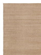 Armadillo Palloza Rug in Rattan, corner close-up of the jute (rattan adds a touch of undyed wool) pile and edge