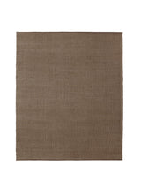 Armadillo Palloza Rug in Shale, a second view of the handwoven jute flatweave rug in a styled interior