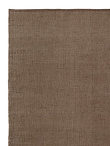 Armadillo Palloza Rug in Shale, corner close-up of the jute (rattan adds a touch of undyed wool) pile and edge