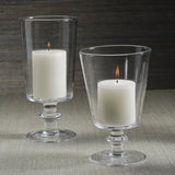 Palmilla Blown Glass Hurricane styled as a candleholder on a tabletop