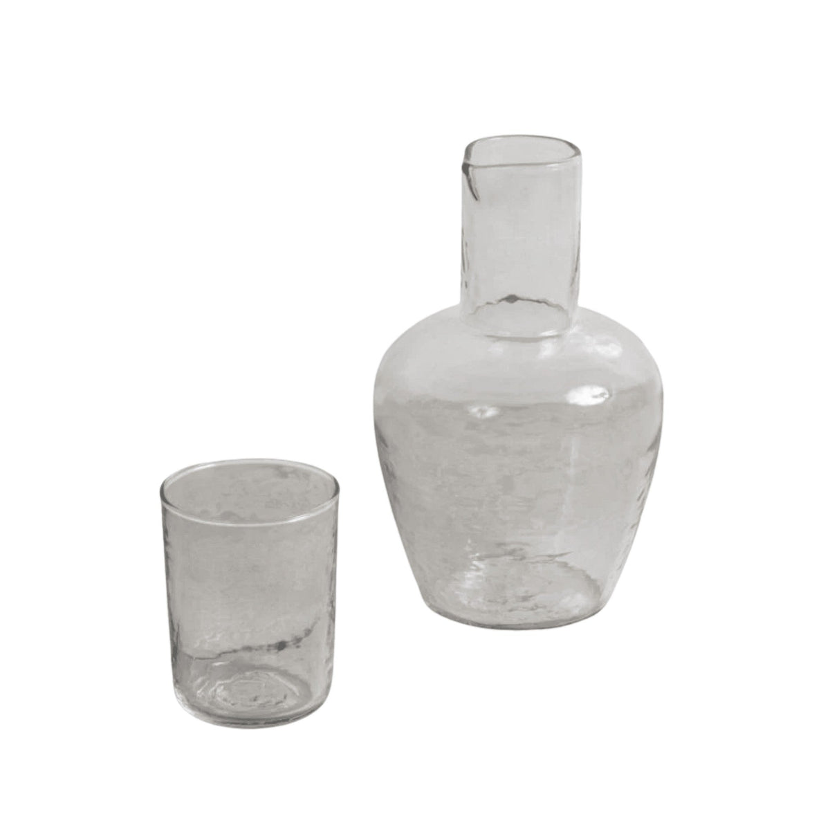 Be Home Pebble Glass Bedside Carafe set with a textured clear glass carafe and matching tumbler for nightstands.