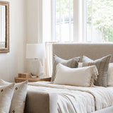 Be Home Pebble Glass Bedside Carafe with matching tumbler on a wooden nightstand in a serene bedroom setting