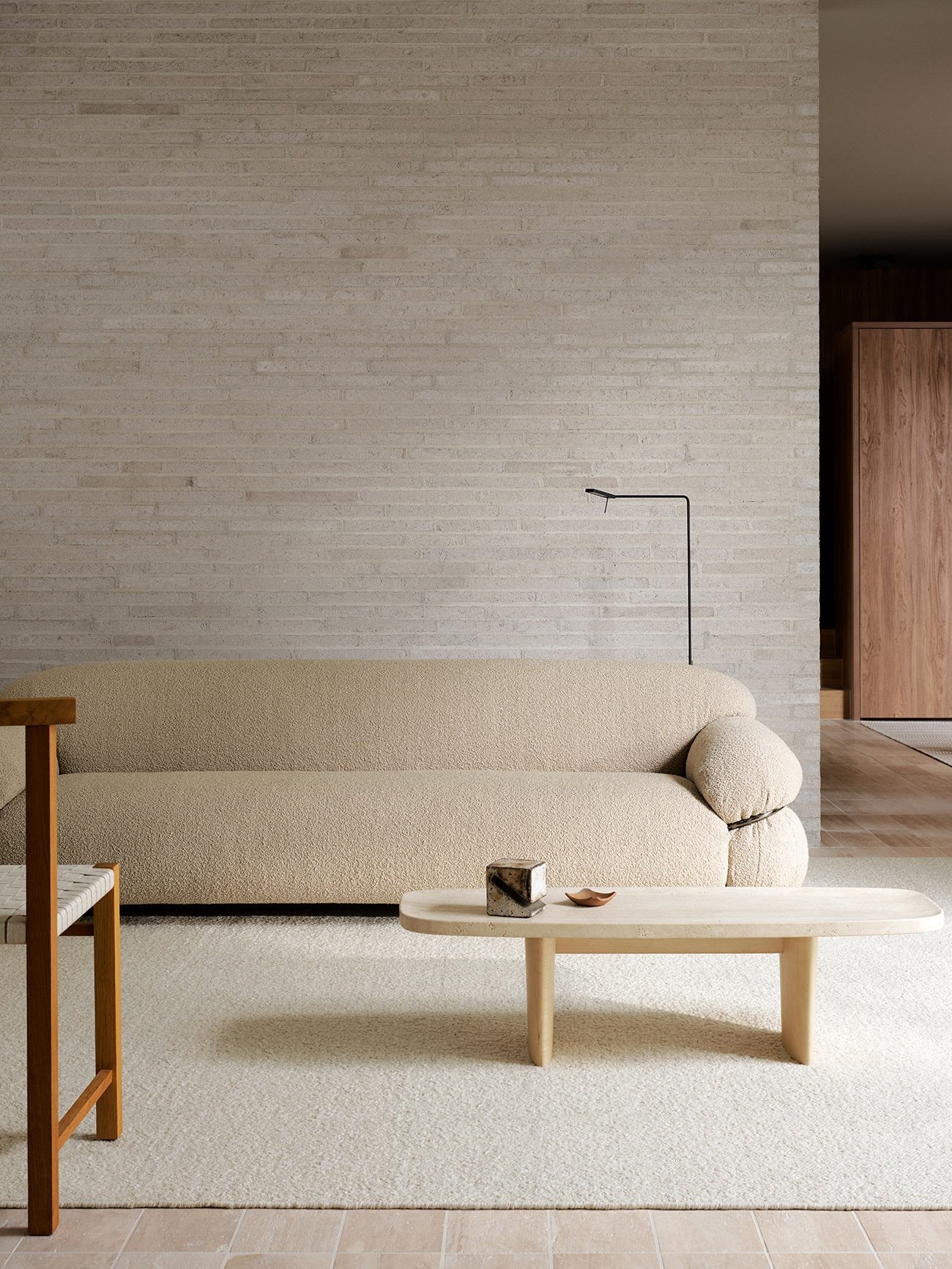 Armadillo Pebble Rug in Tofu, handwoven boucle wool rug shown in a room setting