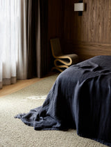 Pebble Rug by Armadillo, handwoven boucle wool rug, styled in a room at Calimia Home