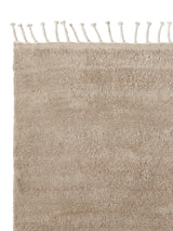 Armadillo Petra Rug in Sparrow, corner close-up of the new zealand wool pile and edge