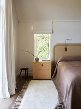 Armadillo Petra Rug in Blanc, hand-knotted new zealand wool rug shown in a room setting