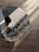 Armadillo Petra Rug in Sparrow, a second view of the hand-knotted new zealand wool rug in a styled interior