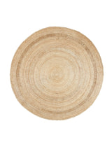 Armadillo Petunia Rug in Natural, a second view of the hand-braided jute rug in a styled interior